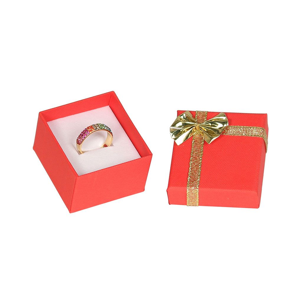 Red jewelry ring box with a gold bow tie