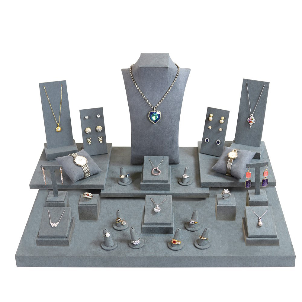 This image depicts a grey suede display that includes 27 fun display sets.